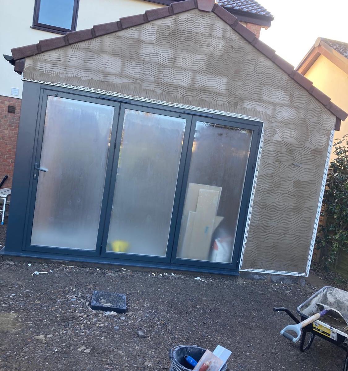 A new extension gable end in combed base coat with beads picking out the verge and door head